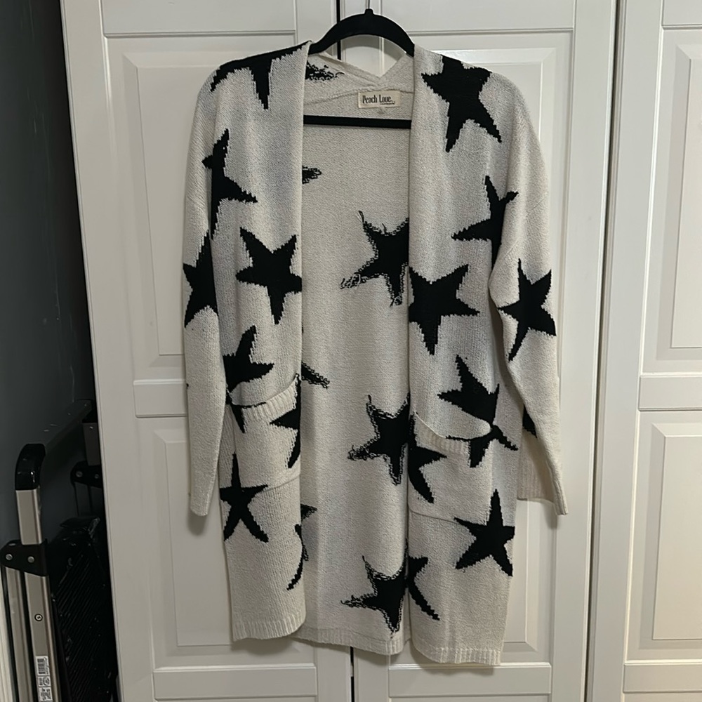 Peach Love California white cardigan with black stars. Size large.